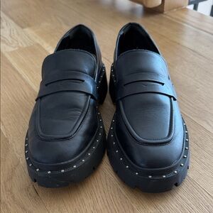 SCHUTZ Black Studded Lug Sole Penny Loafers
